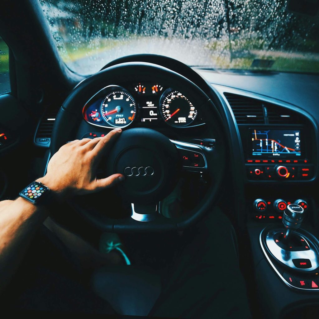 driver wearing watch in Audi